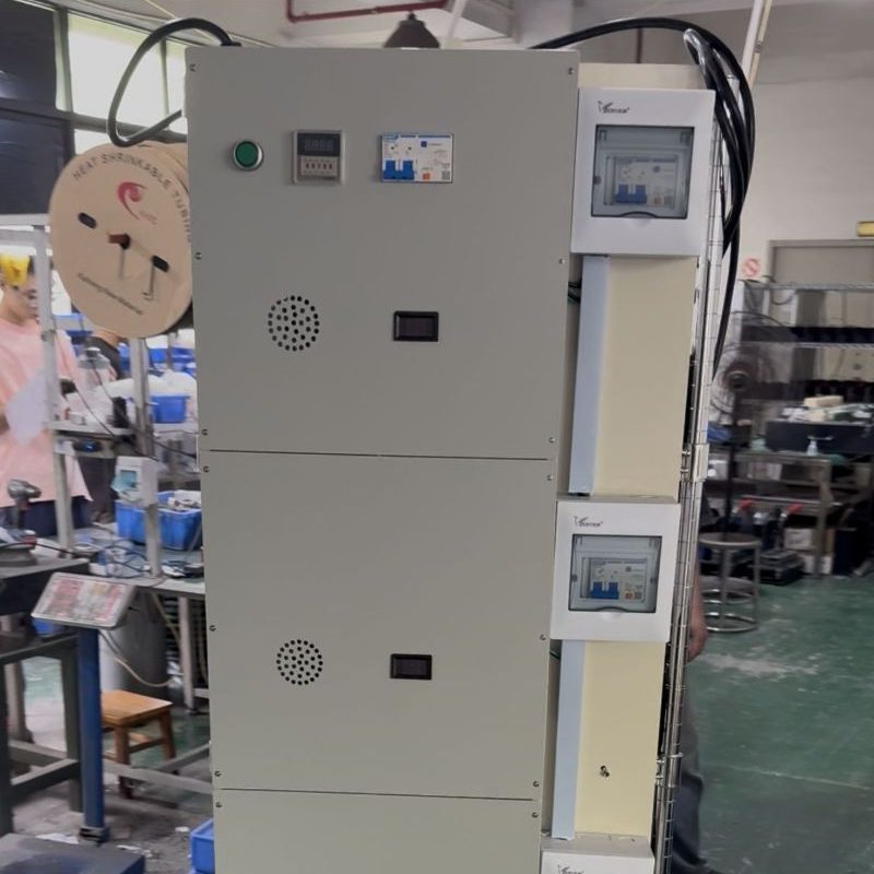 Close-up of multi-circuit power meter, digital display and heat vents on aging rack control box