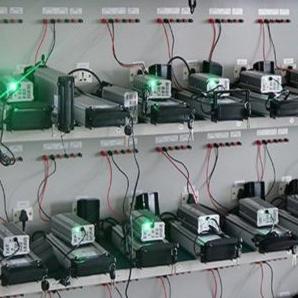 Close-up of battery aging test fixture wiring station, power bank pack burn-in test equipment