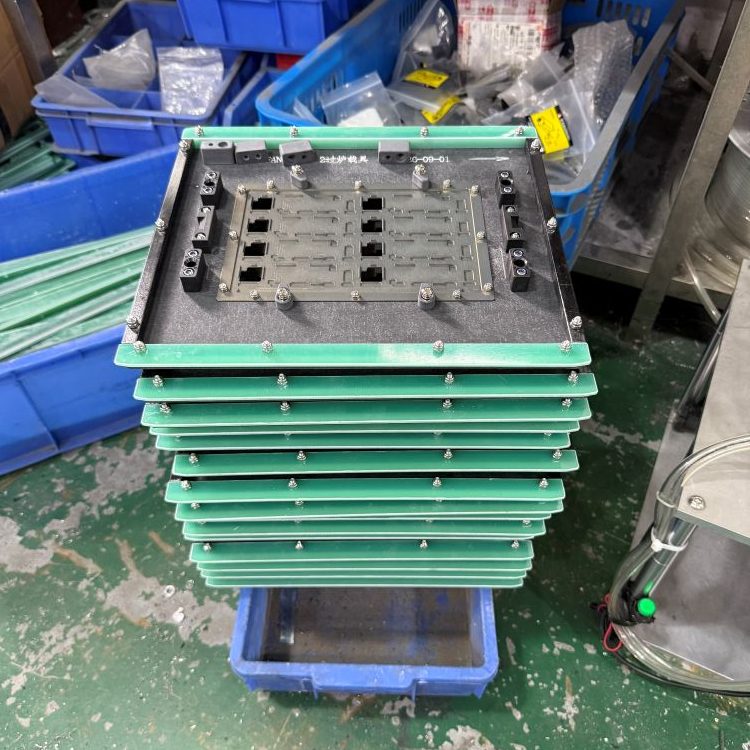 Green full fiberglass edge stackable SMT wave soldering fixture, stacked vertical pile of composite jigs with full green fiberglass border and multi PCB cavities