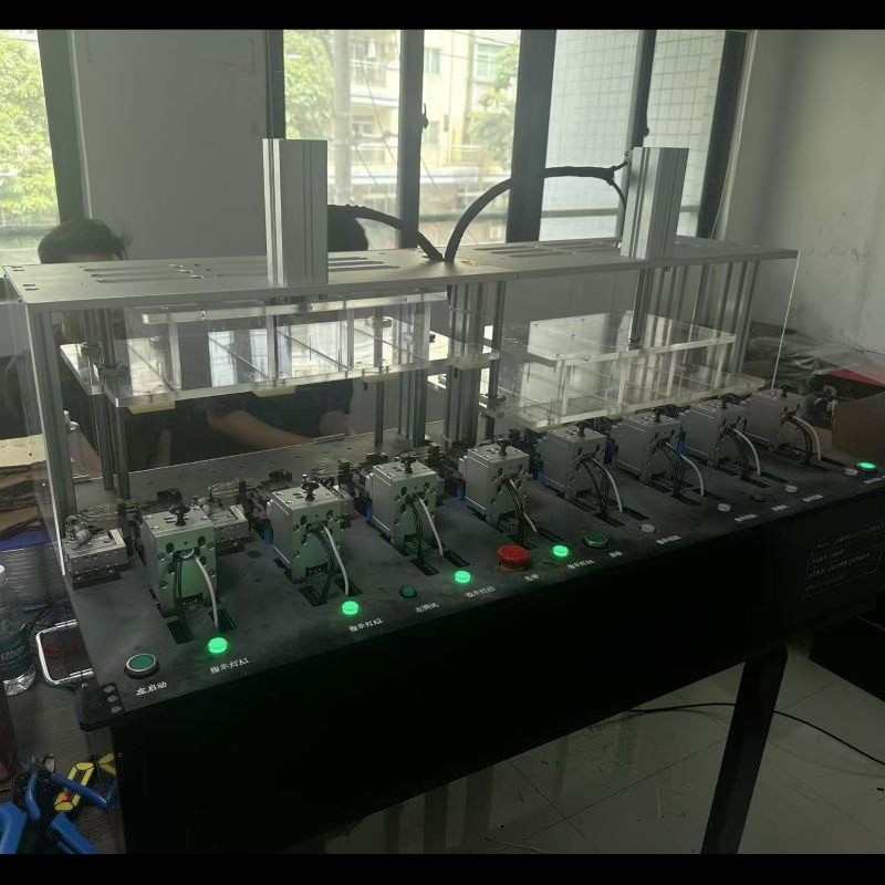 Front exterior view of custom 10‑station ATE‑compatible PCBA test fixture, showing pneumatic cylinders and station status indicator lamps