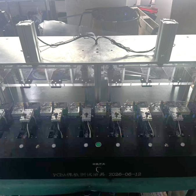 Top overview view of large multi‑station pneumatic bare‑board PCBA test fixture showing multiple test stations and pneumatic cylinders