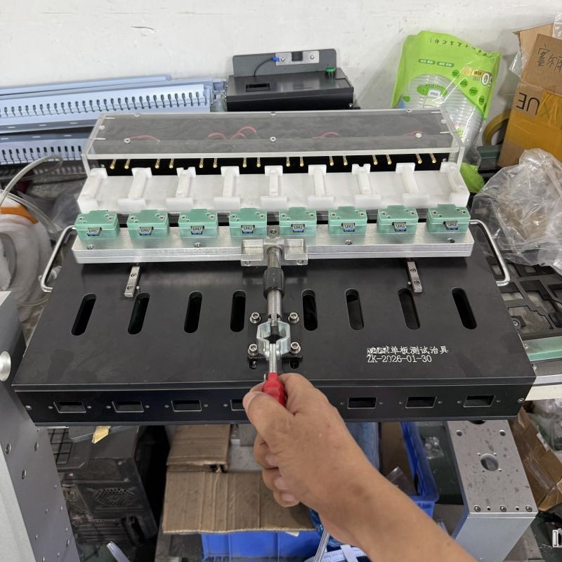 Multi‑station power‑supply & charger PCBA test fixture for batch power board functional testing